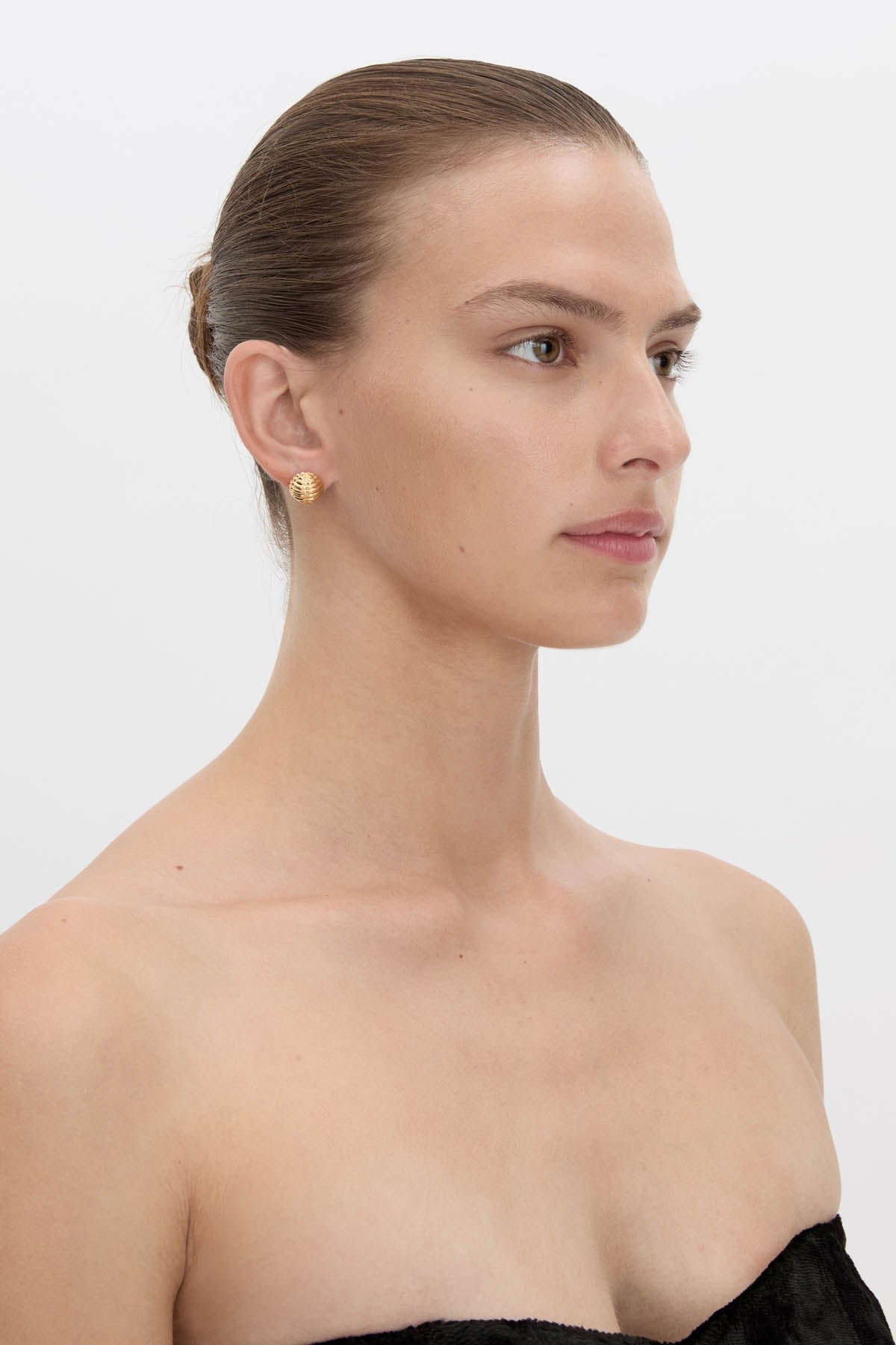 Side view CAMILLA AND MARC Eagan Studs in gold with petite semi‑sphere design and ruched texture.