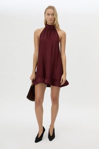 Front view CAMILLA AND MARC Elsen Halter Mini Dress in Burgundy with open back, tie‑up neck and fluted crinoline hem.