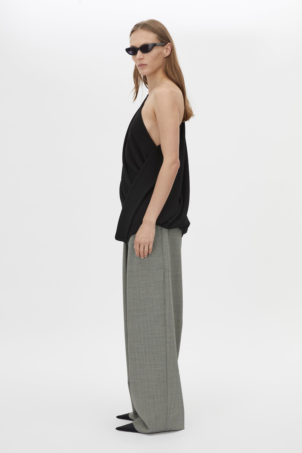 Side view CAMILLA AND MARC Eon Top in Black with a draped asymmetric silhouette.