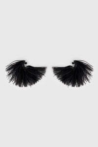 Side view CAMILLA AND MARC Friesian Feather Earrings in Black featuring sculptural soft‑spike hoops fitted with black faux ostrich feathers.