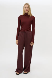 Front view CAMILLA AND MARC Ground Satin Pant in Black with relaxed fit.