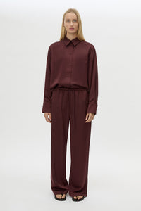 Front view CAMILLA AND MARC Ground Satin Pant in Black styled with the Ground Satin Long Sleeve Shirt.