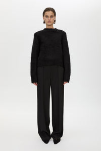 Front styled view CAMILLA AND MARC Ines Knit Sweater in Black with brushed knit texture and ribbed crew neckline.