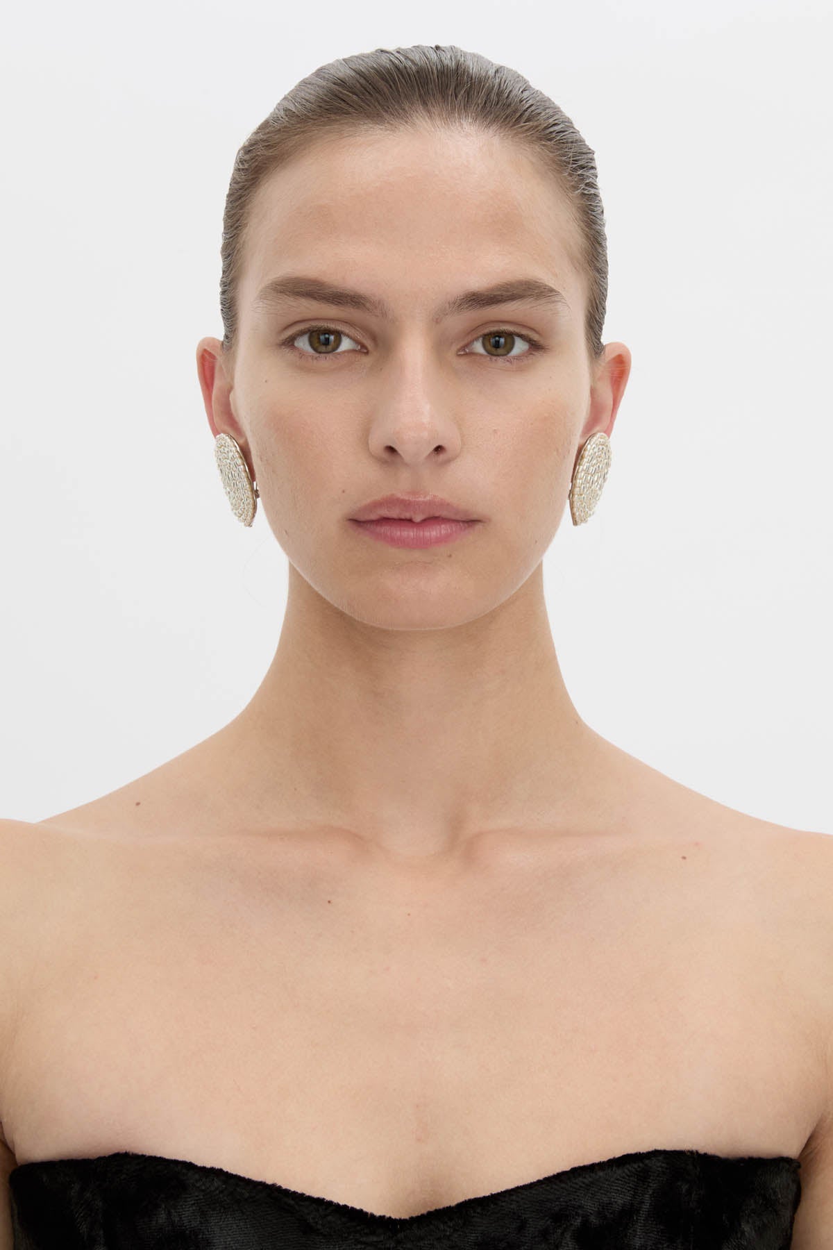 Front view CAMILLA AND MARC Irida Earrings in cream with spiral pearl design.