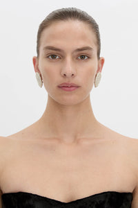 Front view CAMILLA AND MARC Irida Earrings in cream with spiral pearl design.