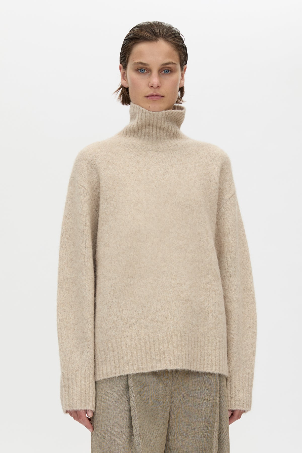 Cropped view CAMILLA AND MARC Leonie Turtleneck Knit Sweater in Oatmeal Marle with relaxed fit, ribbed collar and ribbed hems.