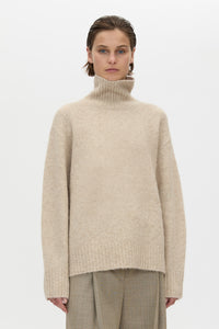 Cropped view CAMILLA AND MARC Leonie Turtleneck Knit Sweater in Oatmeal Marle with relaxed fit, ribbed collar and ribbed hems.