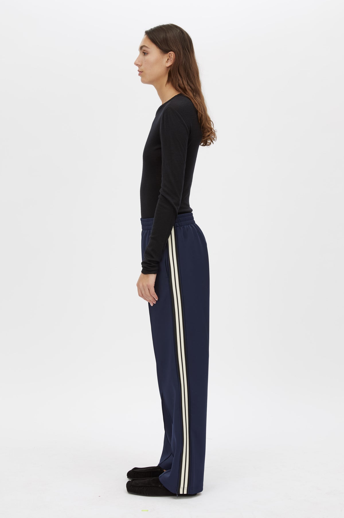 Side view CAMILLA AND MARC Locus Scuba Pant in Midnight with a mid‑rise fit and side‑stripe tape.