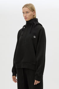 Cropped view CAMILLA AND MARC Lyra Embroidered Hoodie in Black and White with exposed quarter‑zip opening.
