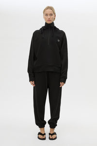 Front styled view CAMILLA AND MARC Lyra Embroidered Hoodie in Black and White with exposed quarter‑zip opening.