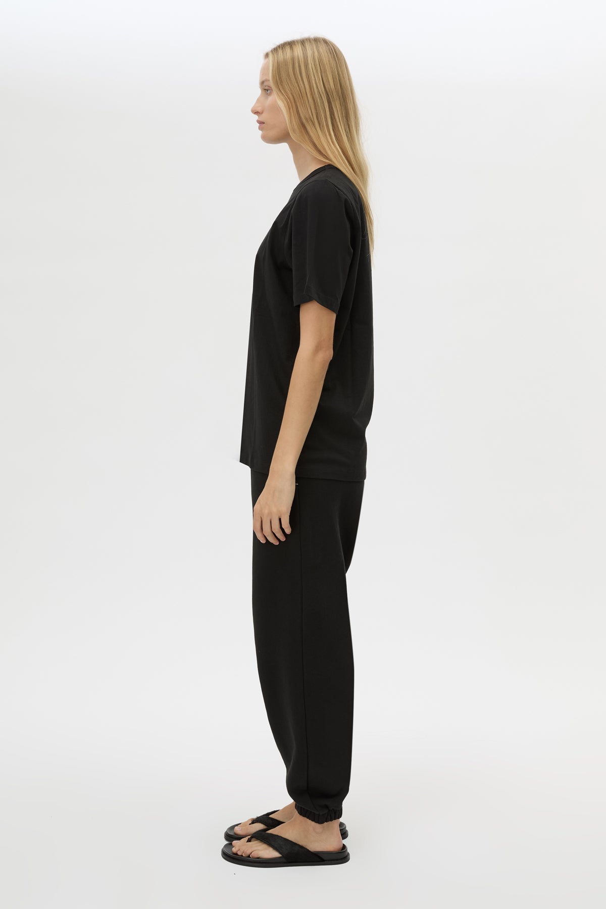 Side view CAMILLA AND MARC Lyra Logo Tee in Black with a 100% cotton fabrication.