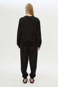 Back view CAMILLA AND MARC Lyra Embroidered Tracksuit Top in Black and White with relaxed fit.