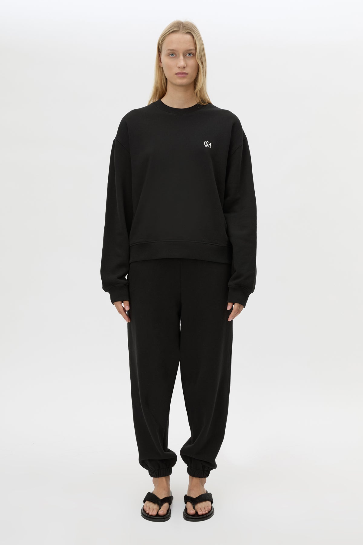 Front styled view CAMILLA AND MARC Lyra Embroidered Tracksuit Top in Black and White with relaxed fit.