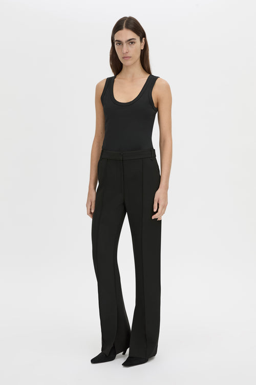 Front-styled view CAMILLA AND MARC Mackinley high-wasited slim leg pant in black with pintuck details.