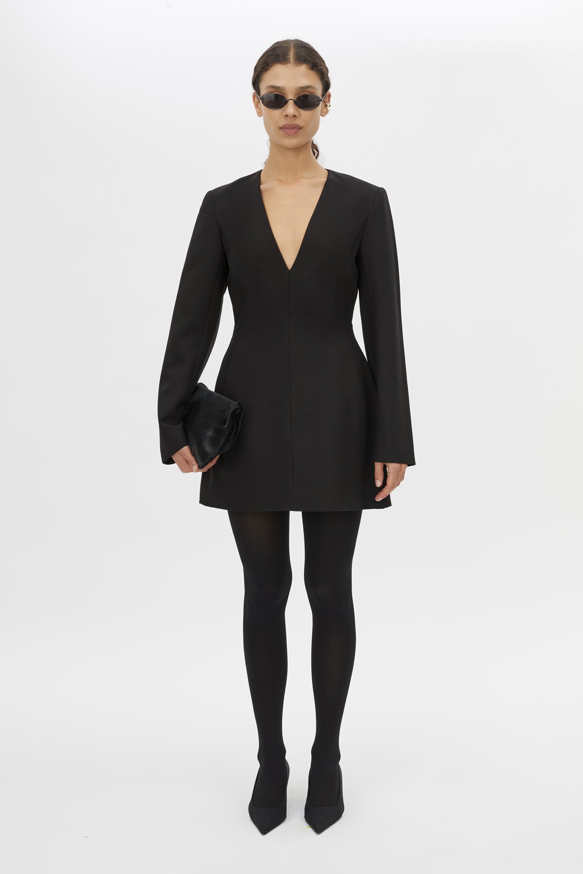 Front styled view CAMILLA AND MARC Mackinley Mini Dress in Black with long sleeves and plunge V‑neckline.