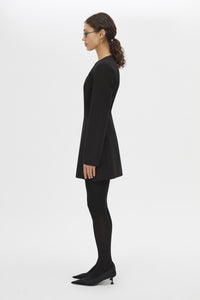 Side view CAMILLA AND MARC Mackinley Mini Dress in Black with long sleeves and plunge V‑neckline.