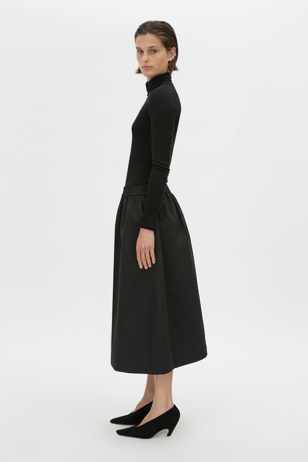 Side view CAMILLA AND MARC Mahdavi midi skirt in black.