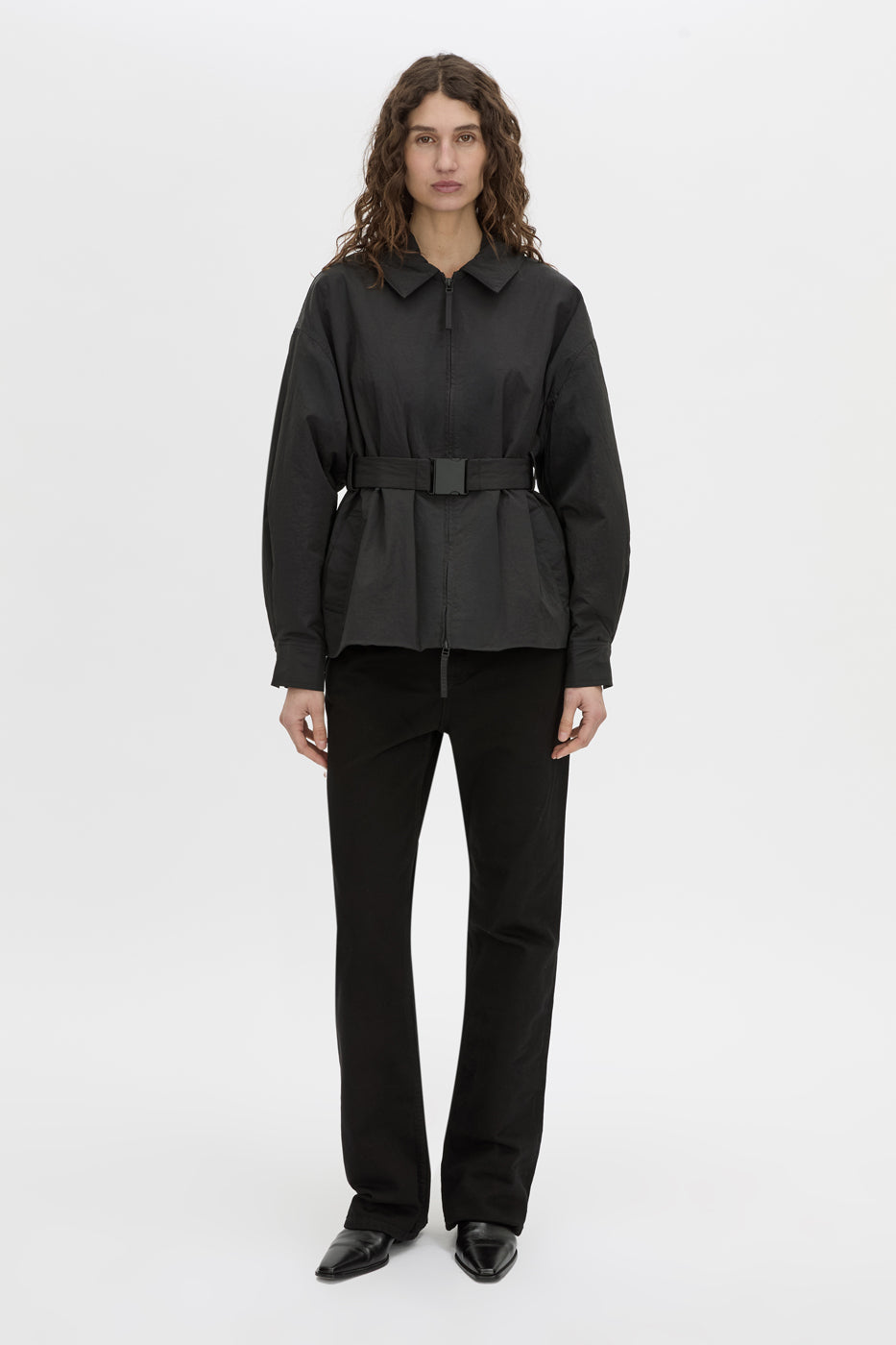 Front-styled view CAMILLA AND MARC Manon Padded Belted Jacket in black with hammered textured fabrication.
