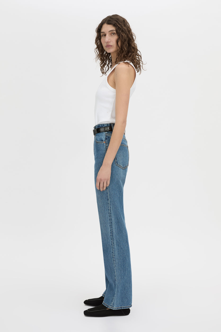 Side view CAMILLA AND MARC Manuela high waisted straight leg classic jean in classic blue.