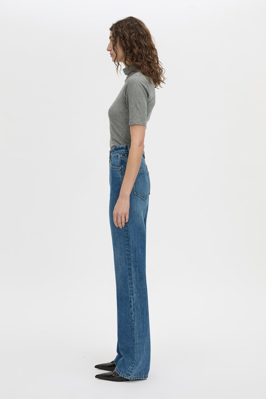 Side view CAMILLA AND MARC Manuela denim jean in dark classic blue.