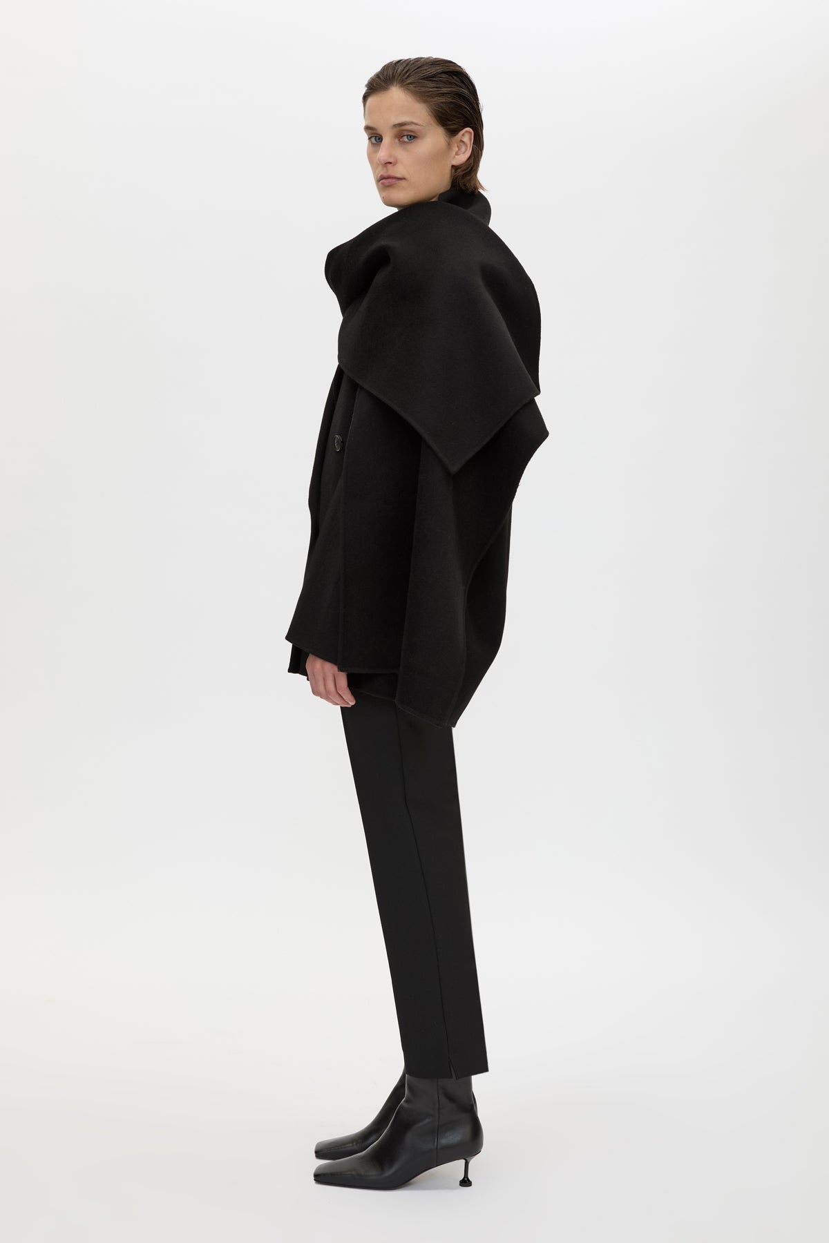 Side view CAMILLA AND MARC Memoria Short Coat in Black with detachable wide scarf.