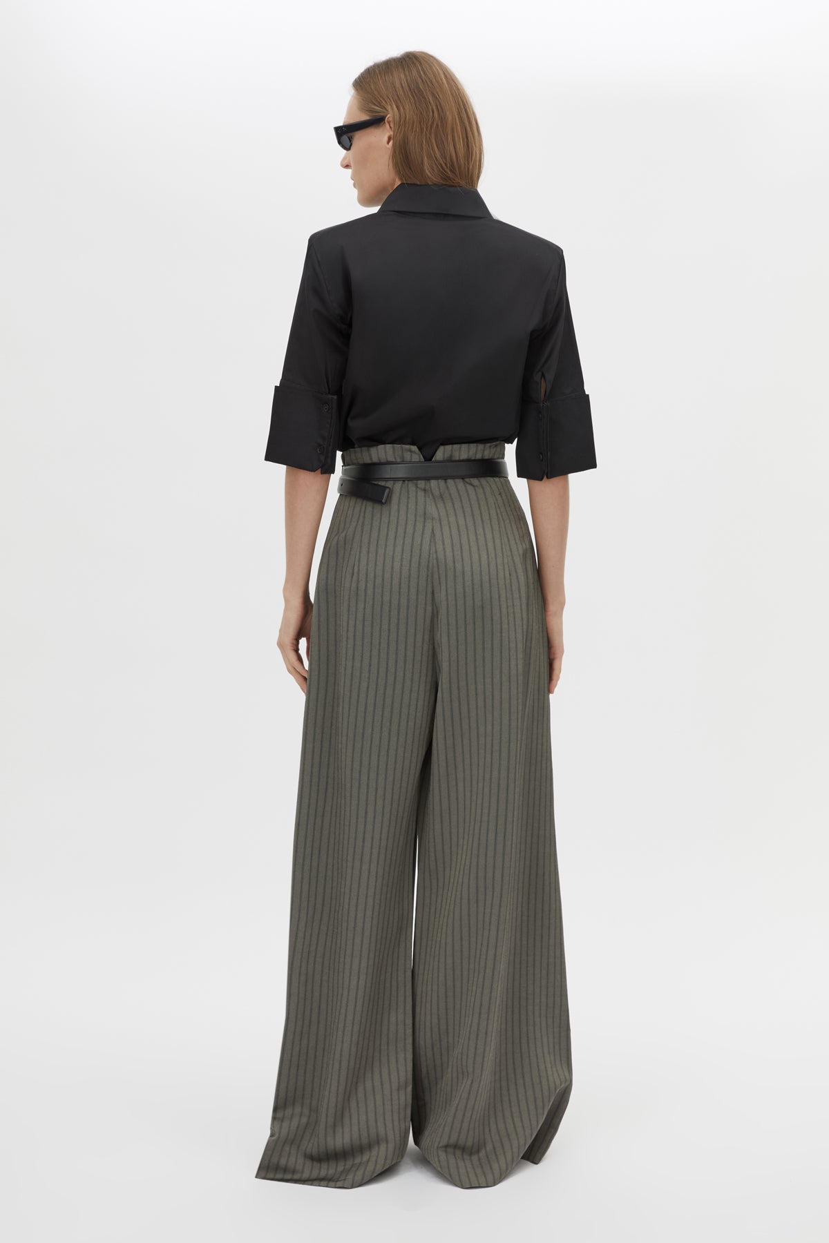 Back view CAMILLA AND MARC Mina Pant in Steel Grey Stripe with a high‑waisted wide‑leg silhouette and corseted waist.