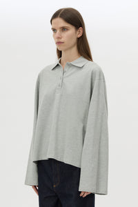 Cropped view CAMILLA AND MARC Moreno Long Sleeve Polo Top in Grey Marle with quarter button placket, rib collar and embroidered monogram.