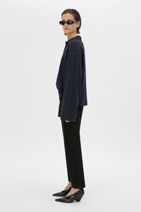 Side view CAMILLA AND MARC cotton Moreno Long Sleeve Polo Top in navy with quarter external button placket.