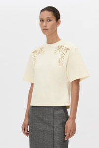 Cropped view CAMILLA AND MARC Niami Crochet Tee in cream with crochet detailing at the shoulder.