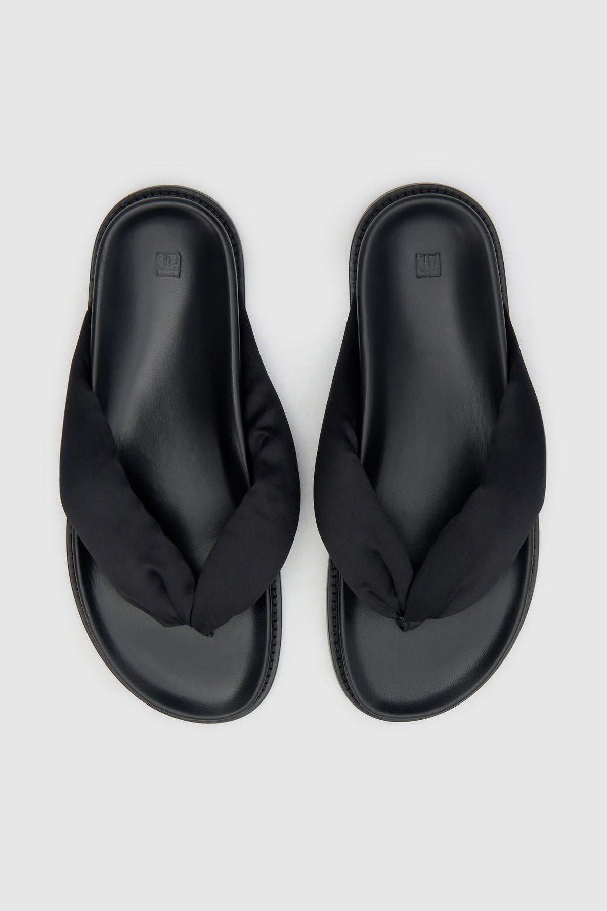 Top view CAMILLA AND MARC Nina Slide Sandal in Black with padded satin straps.