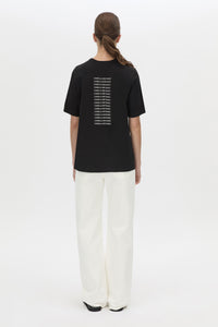 Back view CAMILLA AND MARC relaxed Olympia Print Tee in black with white plastisol artwork at centre back.