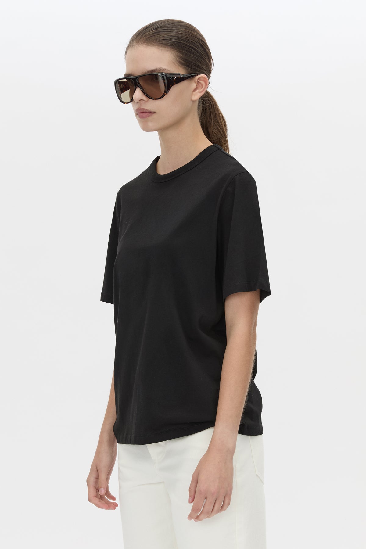 Cropped view CAMILLA AND MARC relaxed Olympia Print Tee in black with white plastisol artwork at centre back.