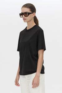 Cropped view CAMILLA AND MARC relaxed Olympia Print Tee in black with white plastisol artwork at centre back.