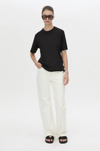 Front-styled view CAMILLA AND MARC relaxed Olympia Print Tee in black with white plastisol artwork at centre back.