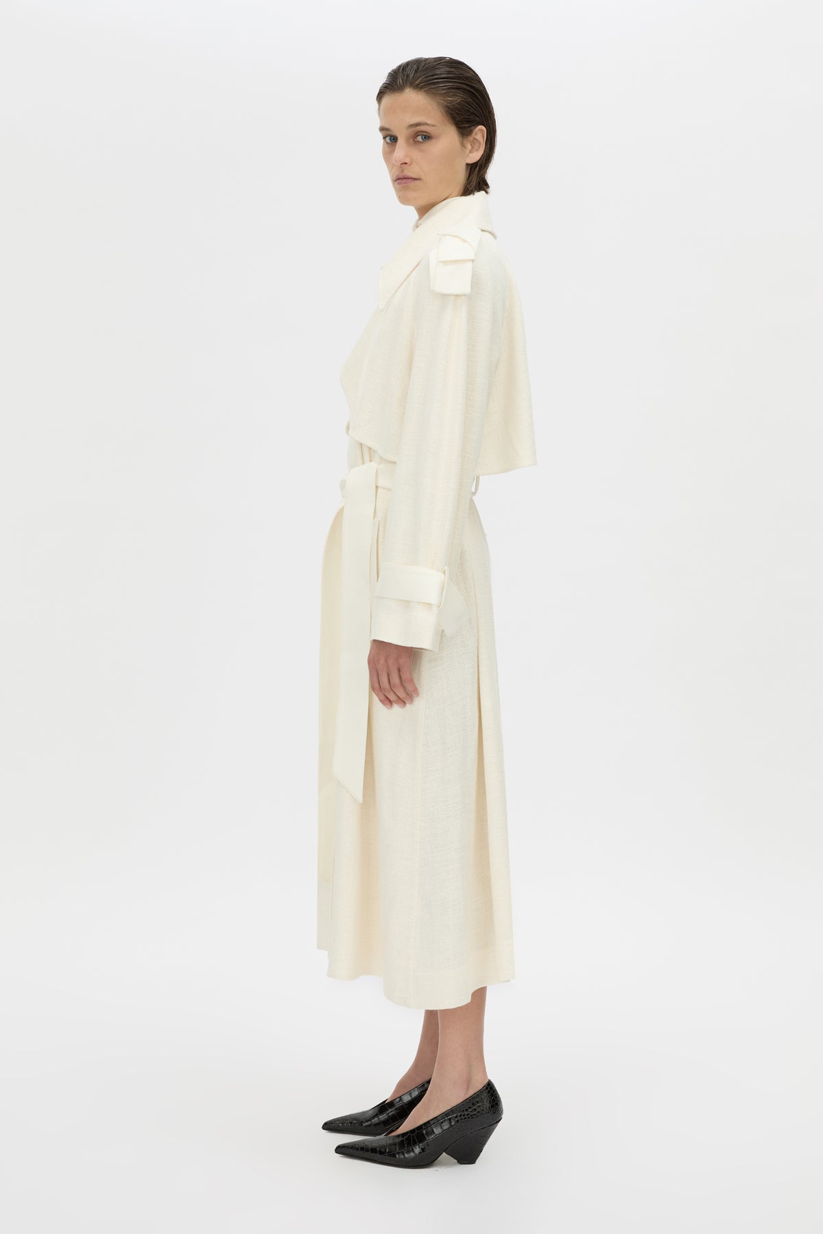 Side view CAMILLA AND MARC Ontario Trench Coat in cream with contrast knot epaulette detailing.
