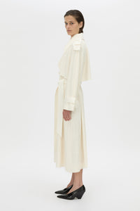 Side view CAMILLA AND MARC Ontario Trench Coat in cream with contrast knot epaulette detailing.