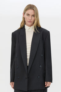 Cropped view CAMILLA AND MARC Orban Oversized Blazer in Navy pinstripe with double‑breasted button closure.