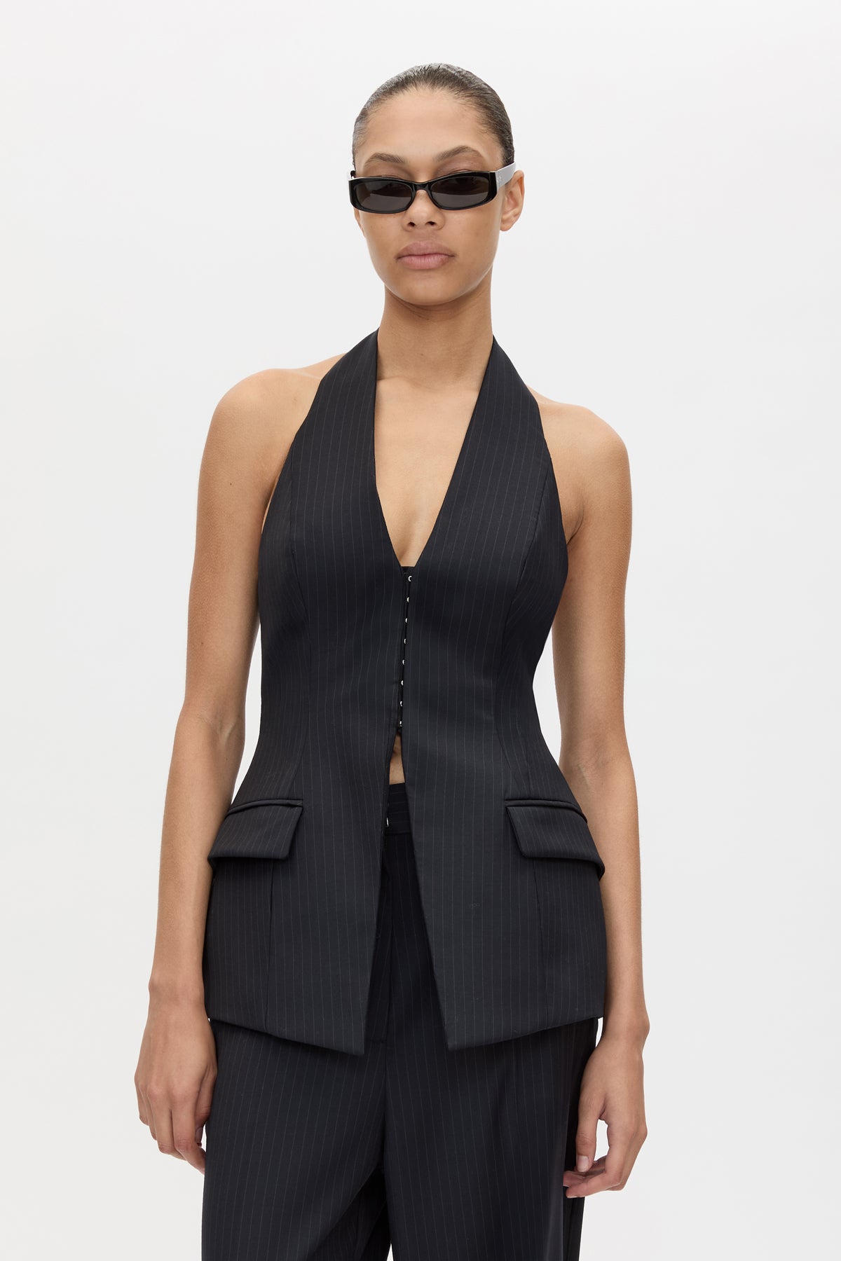 Cropped view CAMILLA AND MARC Orban Tailored Halter Top in Navy Pinstripe with deep V‑neck, fitted waist and open back.