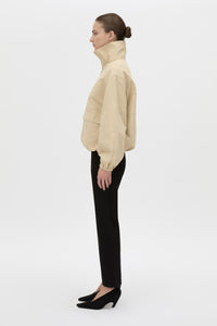 Side view CAMILLA AND MARC Oren Funnel Neck Jacket in ochre stripe with CAMILLA AND MARC monogram embroidery.