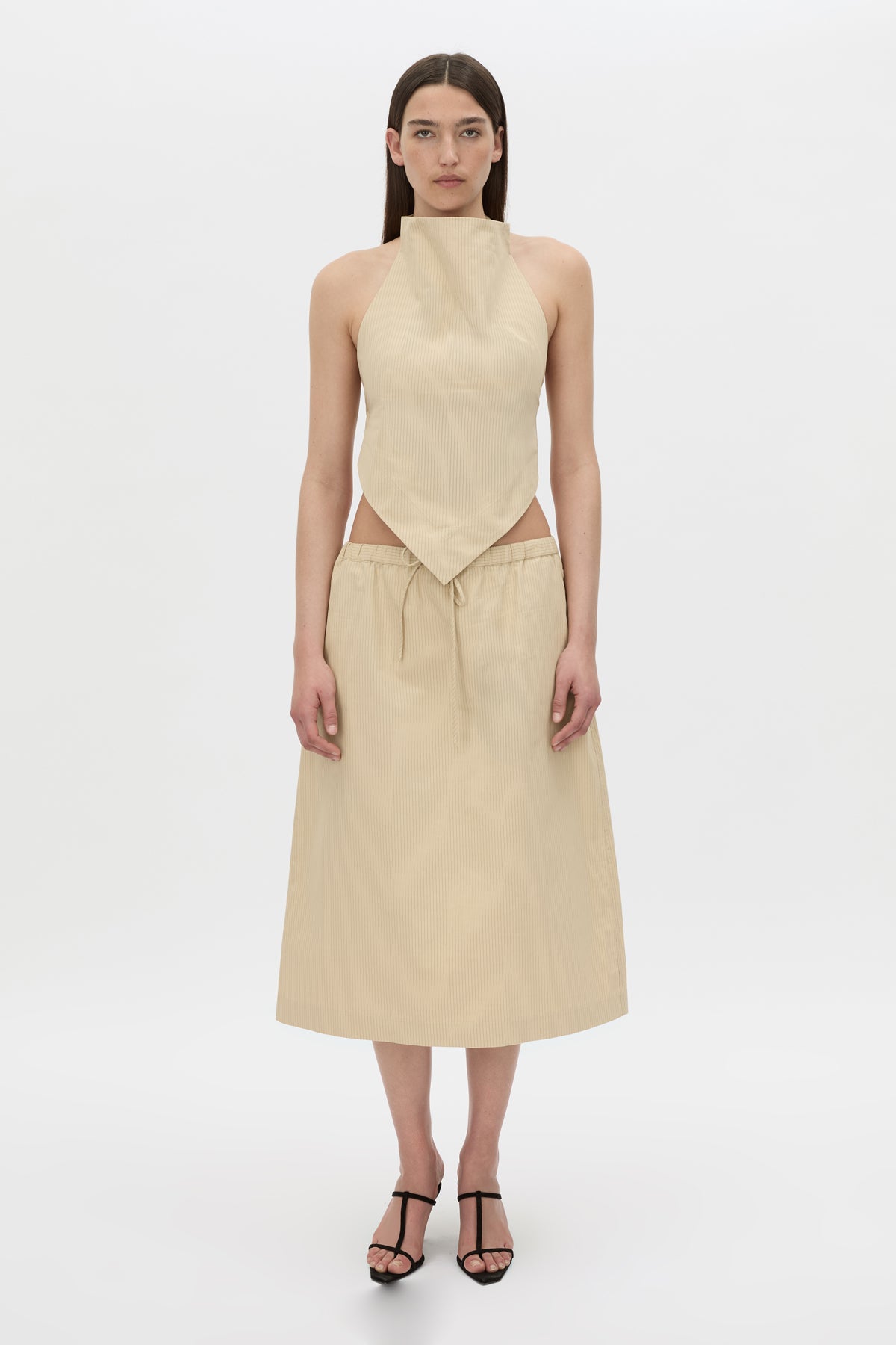 Styled view CAMILLA AND MARC Oren Stripe Crop Top with a handkerchief high-neckline.