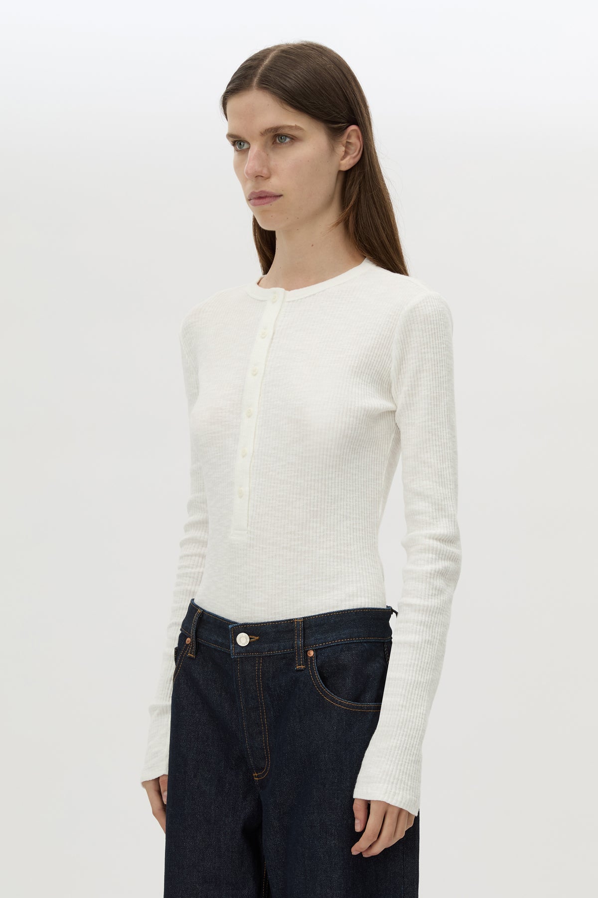Cropped view CAMILLA AND MARC Orion Slub Jersey Bodysuit in White with long sleeves, and rib button placket.