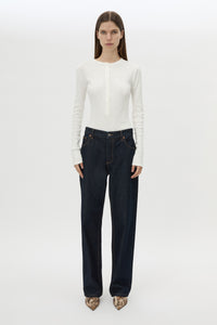Front styled view CAMILLA AND MARC Orion Slub Jersey Bodysuit in White with long sleeves, and rib button placket.