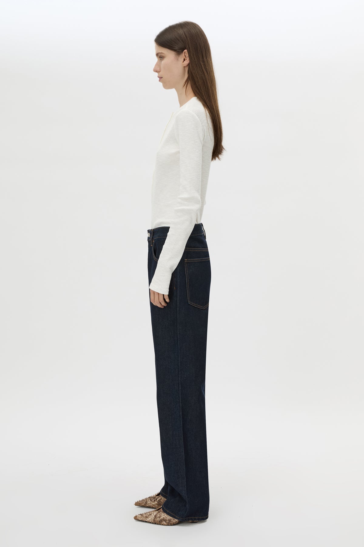 Side view CAMILLA AND MARC Orion Slub Jersey Bodysuit in White with long sleeves, and rib button placket.