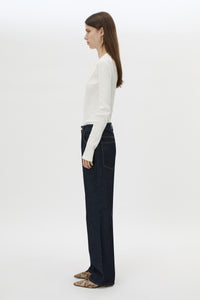 Side view CAMILLA AND MARC Orion Slub Jersey Bodysuit in White with long sleeves, and rib button placket.
