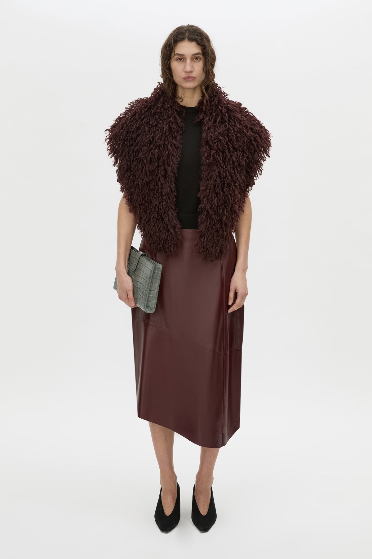 Front-styled view CAMILLA AND MARC Orrin Midi Leather Skirt in burgundy with raw asymmetric hemline.