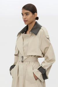 Cropped view CAMILLA AND MARC Passage Volumous Trench in Stone with detachable contrast leather collar and waistbelt.