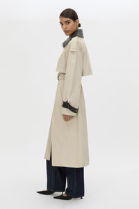 Side view CAMILLA AND MARC Passage Volumous Trench in Stone with detachable contrast leather collar.
