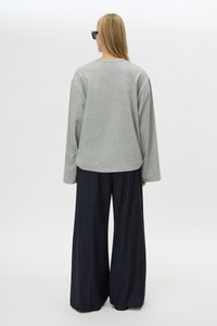 Back view CAMILLA AND MARC Peretti Long Sleeve Tee in Grey Marle with relaxed fit and wide sleeves.