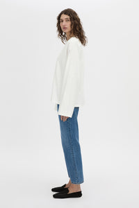 Side view CAMILLA AND MARC Peretti long sleeve tee in white with wide shaped sleeves.