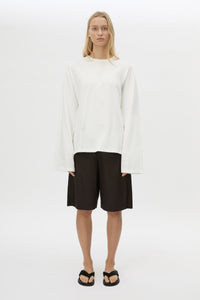 Front view CAMILLA AND MARC Peretti long sleeve tee in white with wide shaped sleeves and ribbed neckline.